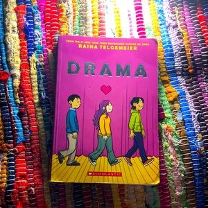A book named Drama by Raina Telgemeier